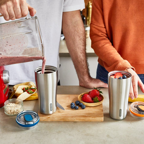 BLACK+BLUM insulated travel tumbler in black, featuring a sleek design and secure lid, ideal for hot or cold beverages on the go.