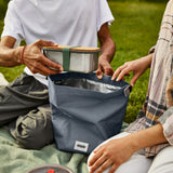 Black+Blum lunchbag with a sandwich box inside, showcasing a sleek black design and spacious 6.7-liter capacity for meal storage.