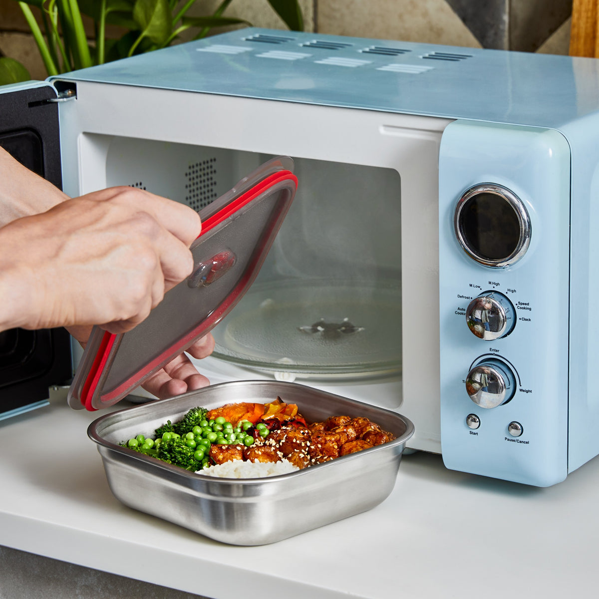 Black+Blum stainless steel multifunctional storage container, microwave-safe, square design for kitchen organization and food storage.