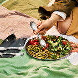 BLACK+BLUM stainless steel Göffel set with four sporks, displayed outdoors with a case and plate, ideal for to-go lunch.