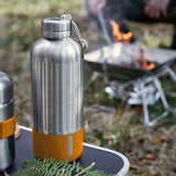 BLACK+BLUM Explorer insulated bottle in orange, showing the sleek design and secure cap, ideal for camping and outdoor use.