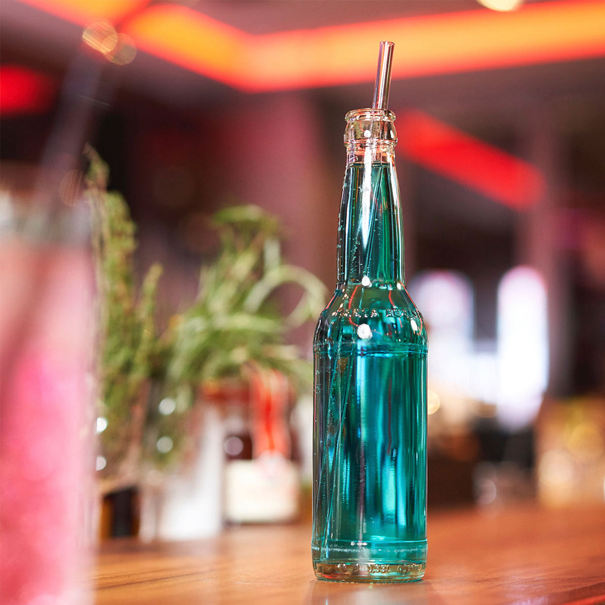 Set of four glass drinking straws in different sizes from Profino Select, clear and reusable for beverages.