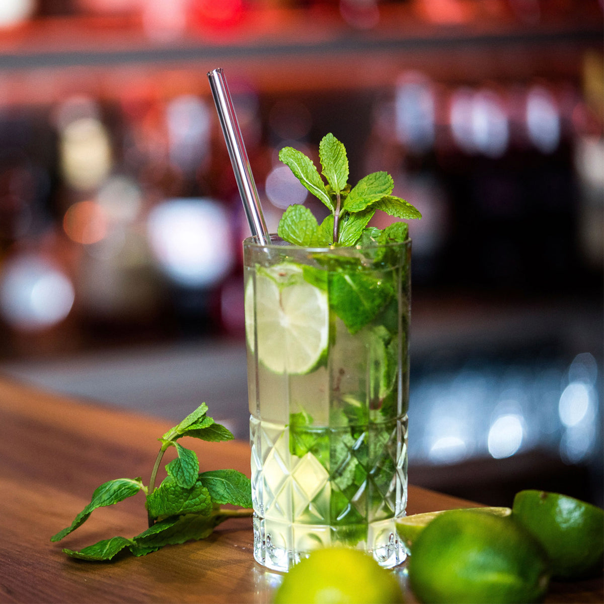 Set of four glass drinking straws in different sizes for beverages, by Profino Select, shown in clear glass with smooth finishes.