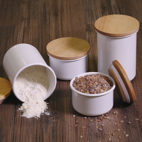HoneyWare enamel storage jar in two sizes, with a smooth finish and secure lid, ideal for kitchen organization.