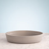 Gray William Mason large oval 1.4L baking dish from Mason Cash, ceramic with a smooth finish, suitable for oven use.