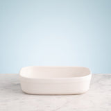 Gray rectangular Mason Cash baking dish with 1.4L capacity, showing slight glaze imperfections inside.