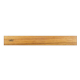 Wooden magnetic knife strip from Zyliss for organizing and safely storing kitchen knives on a wall.