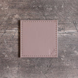 FREEFORM DUO coaster set with four round cork and silicone drink coasters for protecting surfaces.