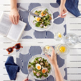 Blue polka dot tablecloth set with lotus effect by DAY DRAP, showing the patterned fabric on a table setting.
