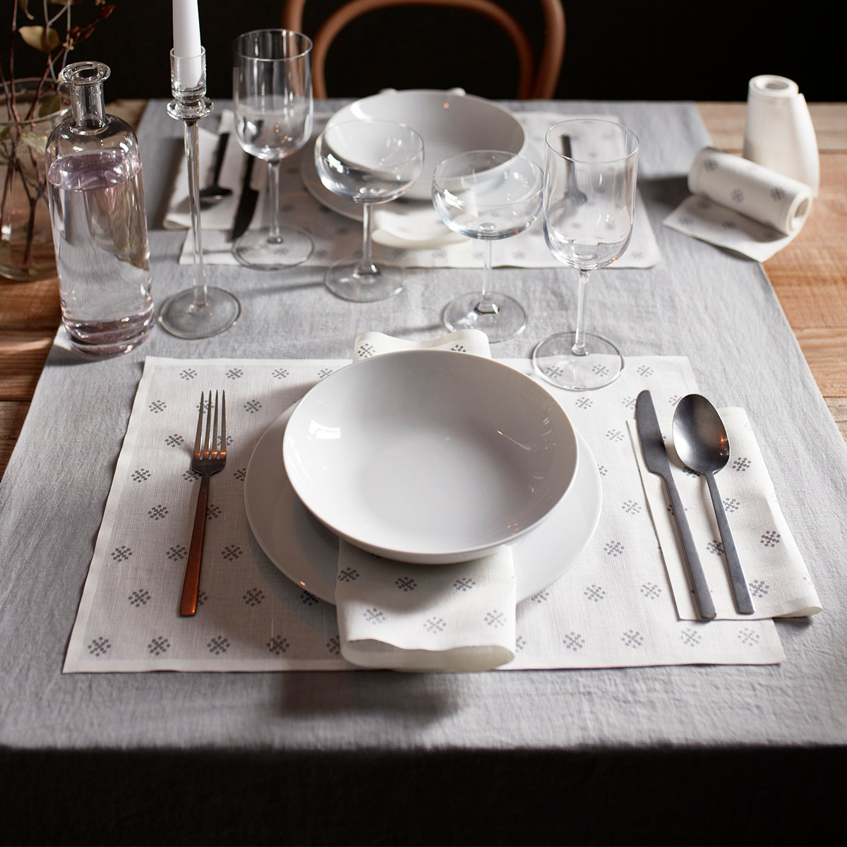 Silver Stars napkin and placemat set by MY DRAP, featuring festive star design in three stylish variants on a white background.