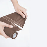 Taupe fabric napkins and placemats from MY DRAP, displayed in four stylish variants, perfect for elegant table settings.