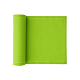 Pistazie-colored napkins and table mats set by MY DRAP, displayed in three variations on a table.
