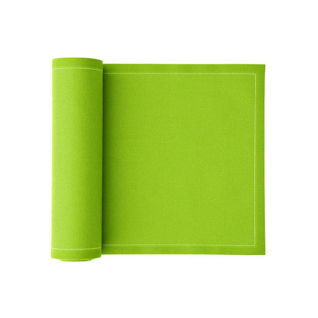 Pistazie-colored napkins and table mats set by MY DRAP, displayed in three variations on a table.