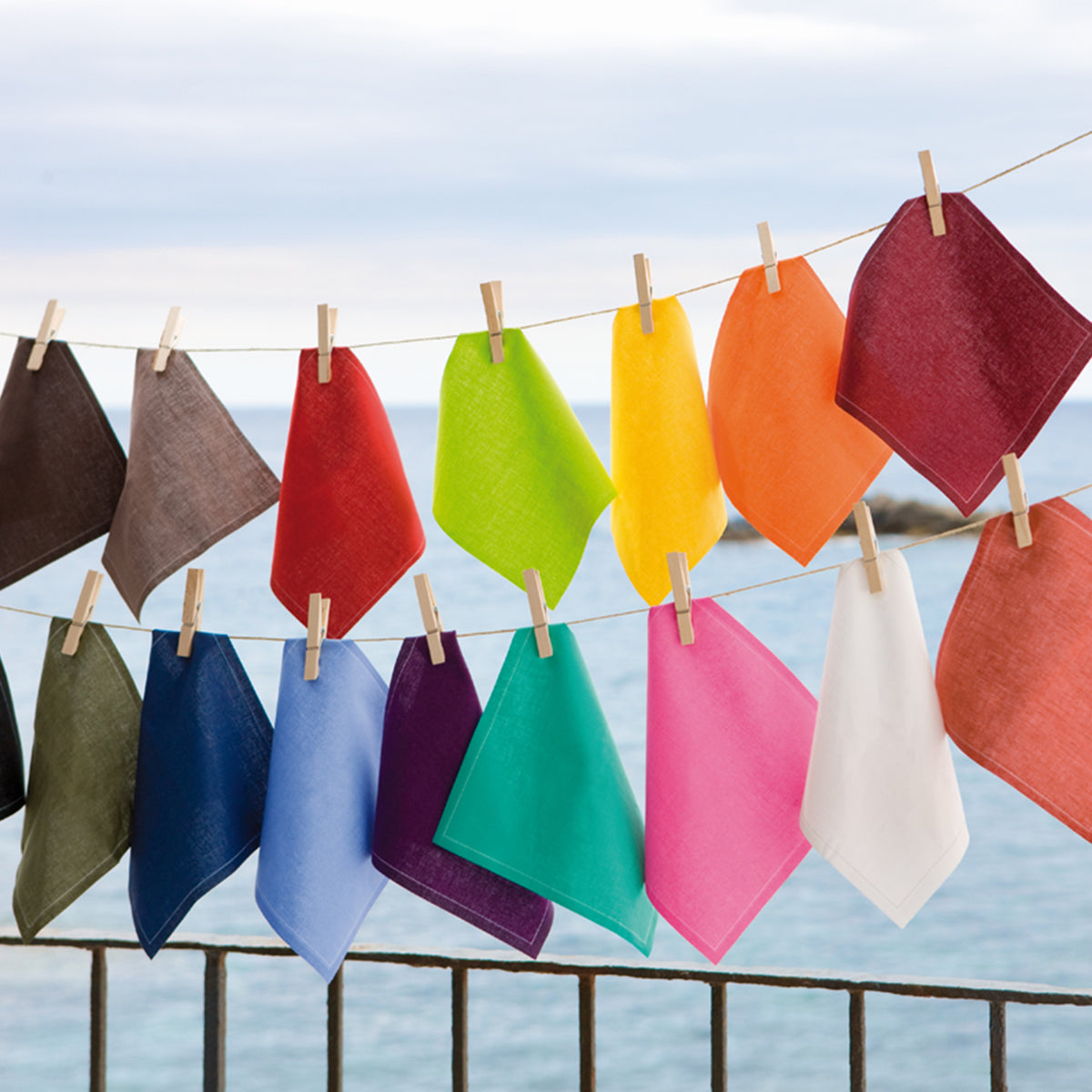 Set of Caribbean Green napkins and placemats from MY DRAP, featuring four stylish variations for elegant table settings.