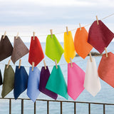 Set of Caribbean Green napkins and placemats from MY DRAP, featuring four stylish variations for elegant table settings.